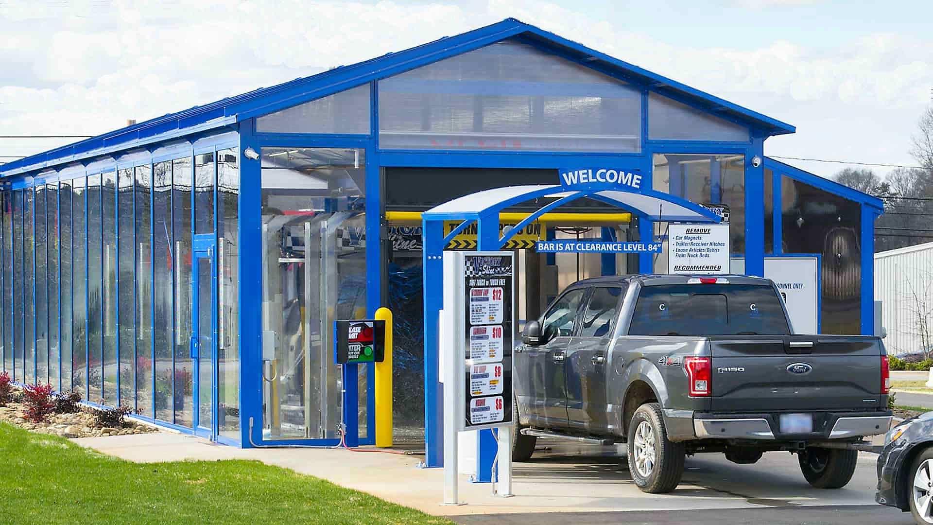 car wash building blue awning to match glass building color